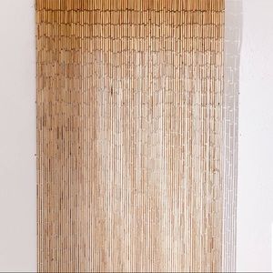 Pair of urban outfitters bamboo beaded curtains.